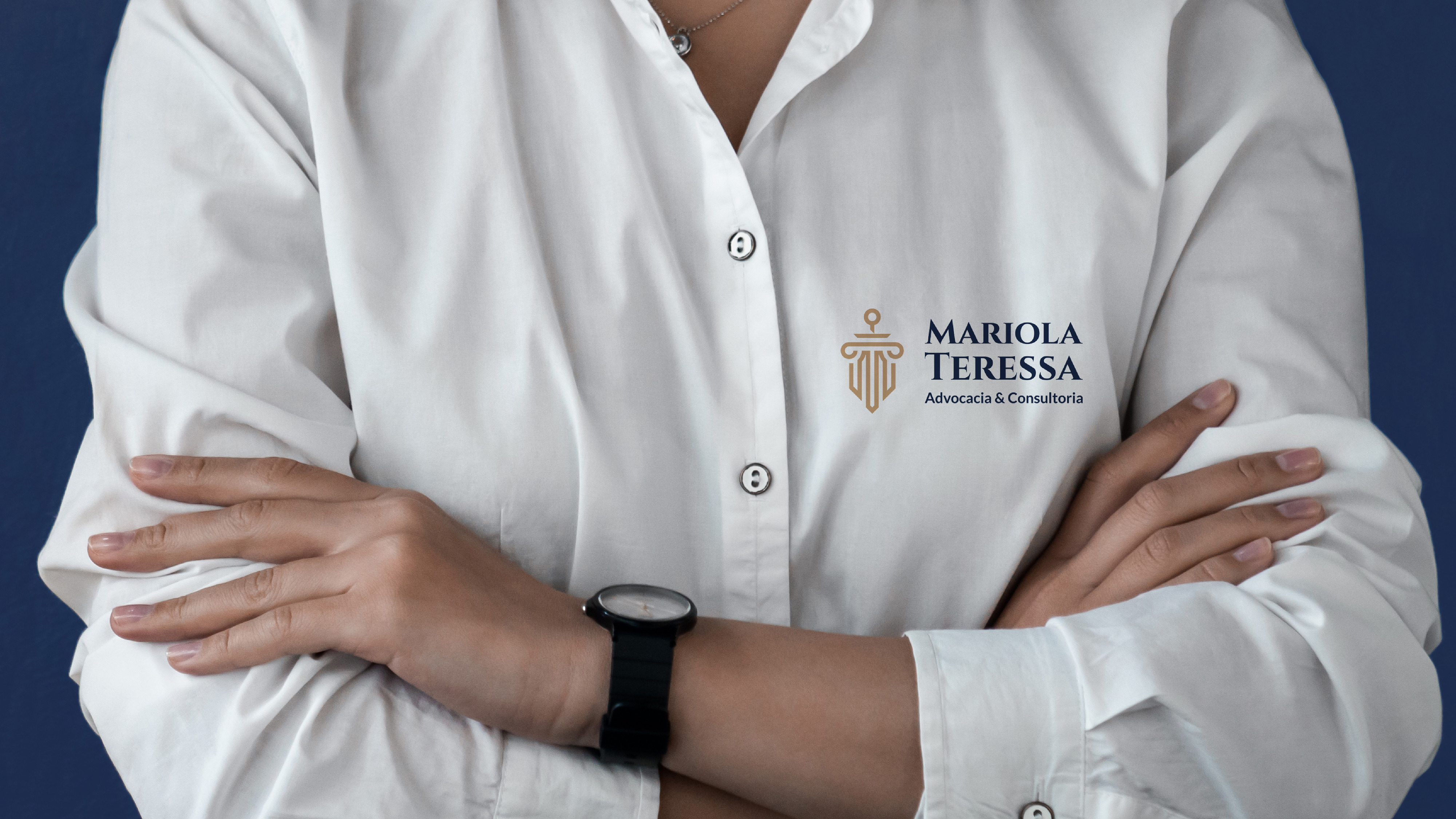 Uniform application — wordmark embroidered on white shirt